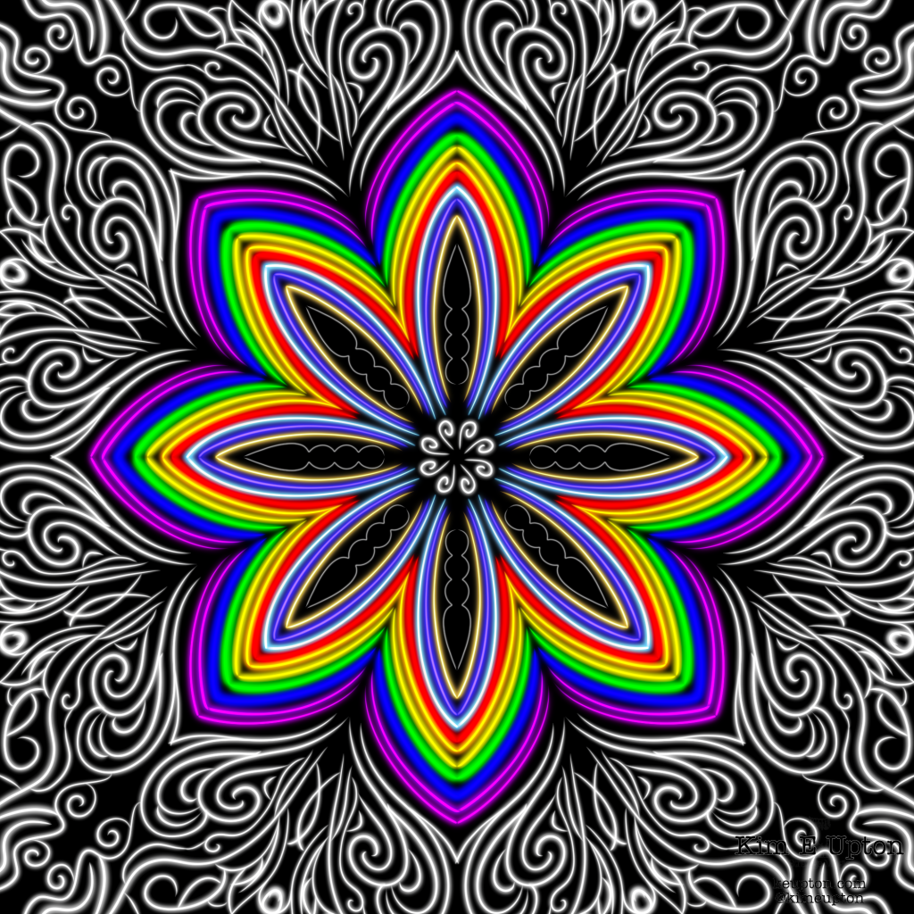 Rainbow colored mandala with intricate white designs on a black background.